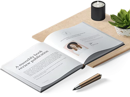 Open book on a desk with a candle and a pen